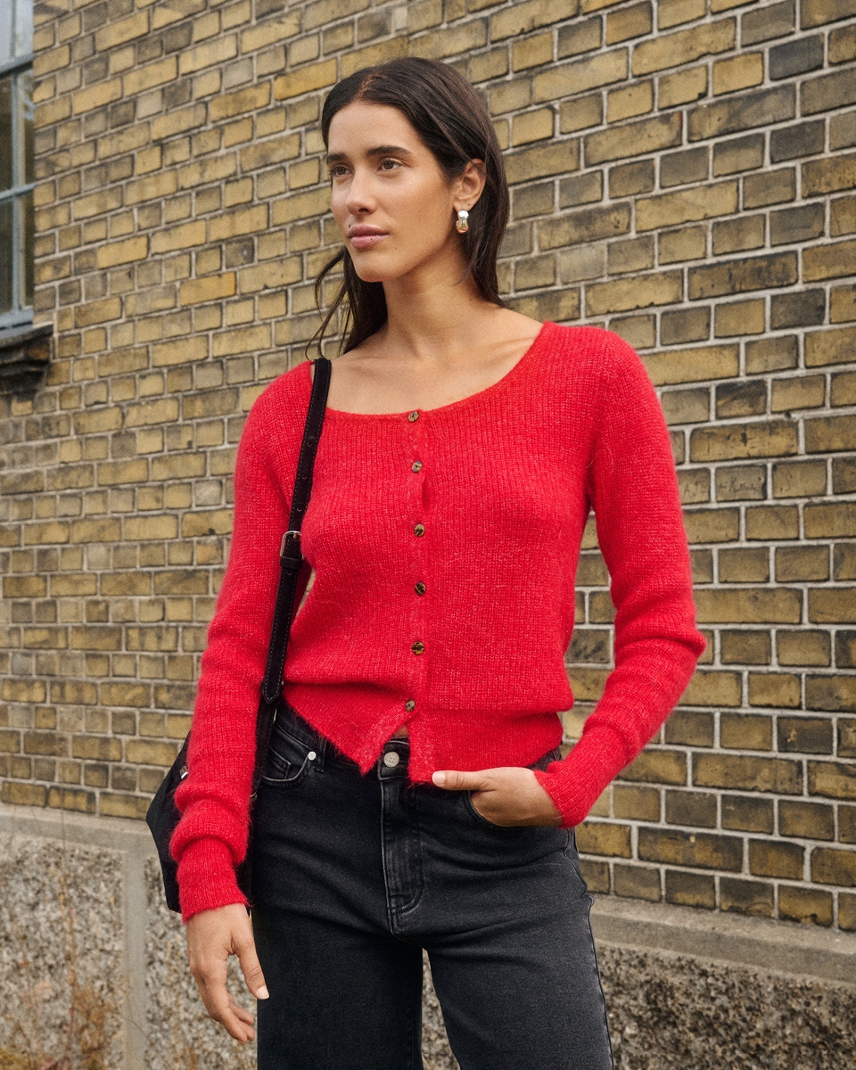 Woman in red knitted cardigan