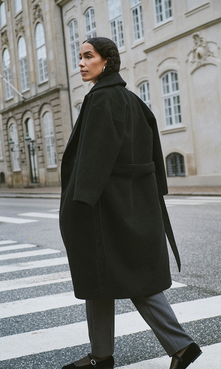 Woman in black coat