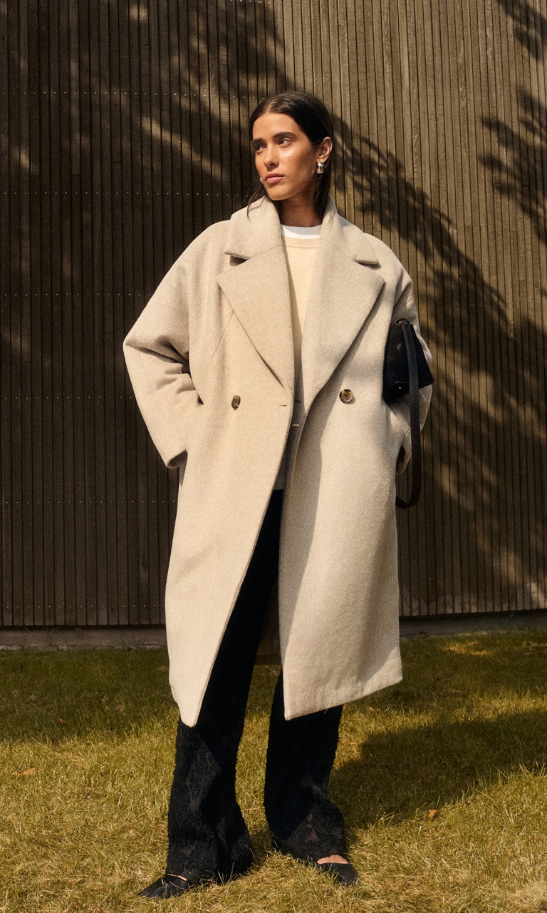 Woman in grey coat